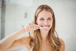 girl brushing her teeth